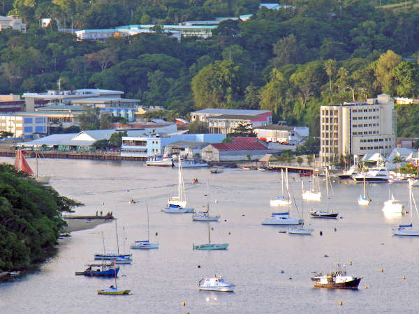 Boats with Port Vila Town - Vanuatu Invest